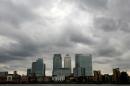 Storm clouds are seen above Canary Wharf financial district in London