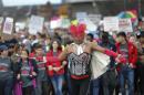Demonstrators march a Women's March rally Saturday Jan. 21, 2017, in Atlanta. Thousands of people marched through Atlanta one day after President Donald Trump's inauguration. (AP Photo/John Bazemore)