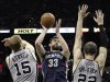 Grizzlies' Gasol shoots against Spurs' Bonner and Splitter during the second half of Game 1 of their NBA Western Conference final playoff basketball game in San Antonio