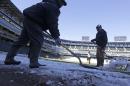 This Monday, March 17, 2014 photo taken in Chicago, shows U.S. Cellular Field, home to the Chicago White Sox baseball team, as members of head groundskeeper Roger Bossard's crew work to ready the field for opening day after one of the most brutal winters the city has ever seen. Brossard described the unusual conditions including 30 inches of permafrost, and having to remove 400 tons of snow from the playing field, as the perfect storm. (AP Photo/M. Spencer Green)