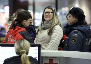 Woman reascts next to Russian Emergencies Ministry&nbsp;&hellip;