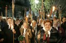 FILE - This a Monday, April 30, 2007 file photo of Argentina's Mothers of Plaza de Mayo hold torches as they rally with torches to mark the 30th anniversary of their first protest around Buenos Aires Plaza de Mayo to demand the return of their disappeared children on April 30, 1977. Tens of thousands of people throughout the world are listed as missing in armed conflicts and after illegal arrests, detentions, abduction or any other form of deprivation of human rights and liberty. On the International Day of the Disappeared on Thursday Aug.30, 2012 the International Commission on Missing Persons (ICMP) called on all governments to provide answers to families on the fate and whereabouts of the missing persons.(AP Photo/Eduardo Di Baia, File)