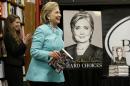 HiIlary Rodham Clinton smiles as she arrives at a book signing for her new book "Hard Choices," at Harvard Book Store, Monday, June 16, 2014, in Cambridge, Mass. (AP Photo/Steven Senne)