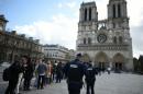 French police patrol outside Notre Dame cathedral