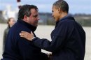 U.S. President Obama talks to New Jersey Governor Christie after arriving at airport in New Jersey