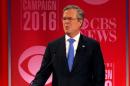 Republican U.S. presidential candidate Bush reacts to an attack from rival candidate Trump at the Republican U.S. presidential candidates debate sponsored by CBS News and the Republican National Committee in Greenville