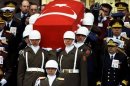Presidential honour guard carry coffin of President Turgut Ozal as Turkish generals with drawn sword..