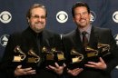 Producers Phil Ramone and John Burk hold the awards won by Ray Charles and his album "Genius Loves ...
