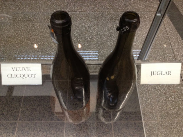 Champagne bottles recovered from a shipwreck. Similar bottles were sold today.