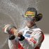 McLaren Formula One driver Hamilton of Britain sprays champagne during the podium ceremony after winning the U.S. F1 Grand Prix in Austin