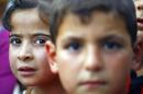 Internally displaced Iraqi children are seen at a shelter on June 29, 2014