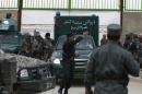 An ambulance leaves Cure Hospital after three foreigners were killed in Kabul