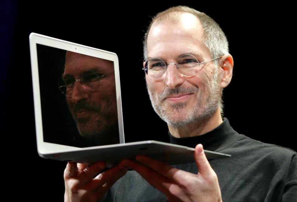 2008 - Apple CEO Steve Jobs holds up the new MacBook Air after giving the keynote address at the Apple MacWorld Conference in San Francisco. Apple on Wednesday, Oct. 5, 2011 said Jobs has died. He was