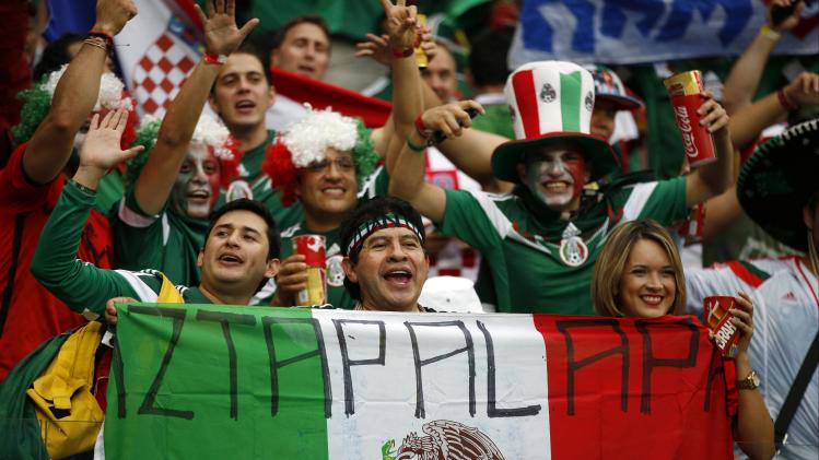 Mexico fans cheer prior to the group A World Cup soccer match between Croatia and Mexico at the Arena Pernambuco in Recife, Brazil, Monday, June 23, 2014. (AP Photo/Eduardo Verdugo)