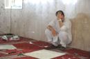 A family member of a slain victim mourns after arriving at the Imam Ali mosque, the site of a suicide bomb attack, in the village of al-Qadeeh in the eastern province of Gatif