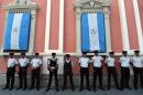 Guatemala police officers stand guard in front of the Electoral Supreme Court (TSE) in Guatemala City on September 3, 2015