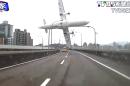 This image taken from video provided by TVBS shows a commercial airplane clipping an elevated roadway just before it careened into a river in Taipei, Taiwan, Wednesday, Feb. 4, 2015. The ATR-72 prop-jet aircraft had 58 people aboard. (AP Photo/TVBS) TAIWAN OUT; ATV HONG KONG OUT;