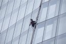 Handout photo of Greenpeace demonstrator Liesbeth Debbens from the Netherlands climbing the Shard building in central London