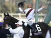 Mike Smith celebrates atop Royal Delta after his victory in the running of the Breeders' Cup Ladies Classic thoroughbred horse race at Santa Anita Park in Arcadia