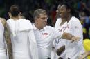 United States head coach Geno Auriemma greets the team after their 110-84 win over Serbia in a women's basketball game against Serbia at the Youth Center at the 2016 Summer Olympics in Rio de Janeiro, Brazil, Wednesday, Aug. 10, 2016. (AP Photo/Carlos Osorio)