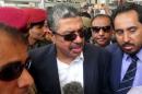 Yemen's Vice President Khaled Bahah talks to reporters upon his arrival at Aden airport
