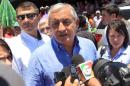 Guatemalan President Otto Perez Molina talks to reporters after an event in Zacapa
