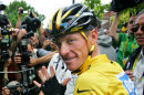 FILE - In this July 24, 2005, file photo, Lance Armstrong gestures for his seventh straight win in the Tour de France cycling race before the final stage between Corbeil-Essonnes, south of Paris, and the French capital. In 2005, Armstrong was also named Associated Press Male Athlete of the Year and ESPN's ESPY Award for Best Male Athlete. He later announced what would be a temporary retirement from cycling in 2005. (AP Photo/Peter Dejong, File)