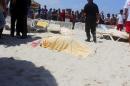 The body of a tourist shot dead by a gunman lies near a beachside hotel in Sousse, Tunisia