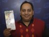 This undated photo provided by the Illinois Lottery shows Urooj Khan, 46, of Chicago's West Rogers Park neighborhood, posing with a winning lottery ticket. The Cook County medical examiner said Monday, Jan. 7, 2013, that Khan was fatally poisoned with cyanide July 20, 2012, a day after he collected nearly $425,000 in lottery winnings.  (AP Photo/Illinois Lottery)