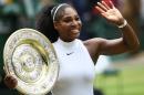 Serena Williams holds the Venus Rosewater Dish after beating Angelique Kerber to win her seventh Wimbledon title on July 9, 2016