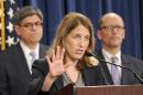 Health and Human Services Secretary Sylvia Burwell, center, flanked by Treasury Secretary and Managing Trustee Jacob J. Lew, left, and Labor Secretary Thomas E. Perez, speaks at a news conference at the Treasury Department in Washington, Monday, July 28, 2014, to discuss the release of the annual Trustees Reports. (AP Photo/Susan Walsh)
