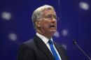 Britain's Secretary of Defence Michael Fallon delivers a speech at the Defence and Security Equipment International trade show in London, Britain