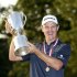 England's Justin Rose raises the U.S. Open Trophy after winning the 2013 U.S. Open golf championship at the Merion Golf Club in Ardmore
