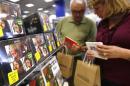Customers browse Beatles collections during their launch in New York