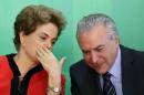 File photo of Brazil's President Dilma Rousseff talking to Vice President Michel Temer at the Planalto Palace in Brasilia
