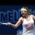 Azarenka of Belarus hits a return during a practice session at the Australian Open tennis tournament in Melbourne