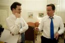 File photogrpah shows Britain's Prime Minister David Cameron speaking to George Osborne in London