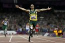 FILE - In this Saturday, Sept. 8, 2012 file photo, South Africa's Oscar Pistorius wins gold in the men's 400-meter T44 final at the 2012 Paralympics, in London. Pistorius has been arrested after a 30-year-old woman was shot dead at his home in South Africa, early Thursday, Feb. 14, 2013. (AP Photo/Kirsty Wigglesworth, File)
