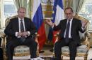 Russian President Vladimir Putin, left, and French President Francois Hollande, right, meet for bilateral talks at the Elysee Palace in Paris, France, Friday, Oct. 2, 2015. Russian President Vladimir Putin is meeting the leaders of Ukraine, France and Germany in a revived European push to bring peace to eastern Ukraine. The long-awaited summit in Paris on Friday is being overshadowed by international concerns about Russia's military intervention in Syria this week. (AP Photo/Michel Euler, Pool)