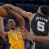San Antonio Spurs guard Cory Joseph, right, blocks a shot by Los Angeles Lakers guard Andrew Goudelock during the second half in Game 3 of a first-round NBA basketball playoff series, Friday, April 26, 2013, in Los Angeles. (AP Photo/Mark J. Terrill)