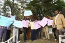 Ugandan anti-gay activist Pastor Ssempa leads anti-gay supporters as they celebrate after Uganda's President Museveni signed a law imposing harsh penalties for homosexuality in Kampala