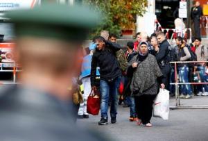 Migrants arrive by train at main station in Munich