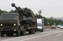 Russian military truck loaded with Msta-S self-propelled howitzer drives along the road outside Kamensk-Shakhtinsky