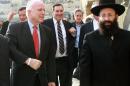 US Senator John McCain (L) visits the Western Wall in the Old City of Jerusalem during a tour with a Senate delegation on January 19, 2015