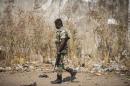 A Senegal soldier patrols at the Gambia border with Senegal in the town of Karang, Senegal, Friday, Jan. 20, 2017. Gambia's defeated President Yahya Jammeh must cede power by noon Friday or he will be dislodged by a regional force that has already moved into the country, West African officials said. (AP Photo/Sylvain Cherkaoui)