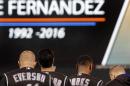Colorado Rockies including Darin Everson, left, observe a moment of silence for Miami Marlins' pitcher Jose Fernandez prior to a baseball game against the San Francisco Giants, Tuesday, Sept. 27, 2016, in San Francisco. Fernandez was killed in a boating accident on Sunday, Sept. 25, 2016. (AP Photo/Ben Margot)