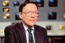 In this June 28, 1988 photo released by CBS, CBS News correspondent Bruce Morton poses on the set of the CBS news room in New York. Morton, an award-winning political correspondent for CBS News who also covered the Vietnam War and the space program, died Friday, Sept. 5, 2014, at his home in Washington, D.C., after a battle with cancer. He was 83. (AP Photo/CBS)