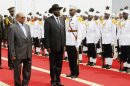 Sudanese President Omar al-Bashir, left, and South Sudanese President Salva Kiir inspect a guard of honor at Khartoum airport in Khartoum, Sudan, Tuesday, Sept. 3, 2013. Kiir took a day trip to Khartoum. South Sudan peacefully broke away from Sudan in 2011, but tensions between the countries remain high, especially over their intertwined oil industries. The U.N. Security Council last month demanded an end to escalating violence in Sudan's Darfur region and more robust action by peacekeepers. (AP Photo/Abd Raouf)
