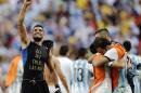 CORRECTS PHOTOGRAPHER'S BYLINE - Argentina goalkeeper Sergio Romero, left, and teammates celebrate at the end of the World Cup quarterfinal soccer match between Argentina and Belgium at the Estadio Nacional in Brasilia, Brazil, Saturday, July 5, 2014. Argentina won 1-0. (AP Photo/Eraldo Peres)