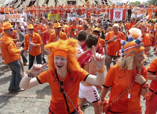 Netherlands soccer fans sing as they party at the Euro 2012 fan zone in Kharkiv